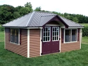 Tea house mini barn. Custom built playhouse for back yard storage and play by Martin's Mini Barns